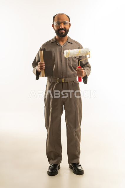 Saudi Painter in Brown Jumpsuit with Paint Roller