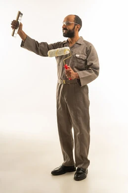Saudi Painter in Brown Uniform Holding Tools