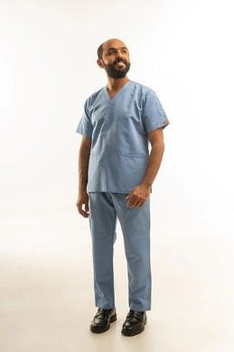 Saudi Male Medical Professional in Blue Scrubs