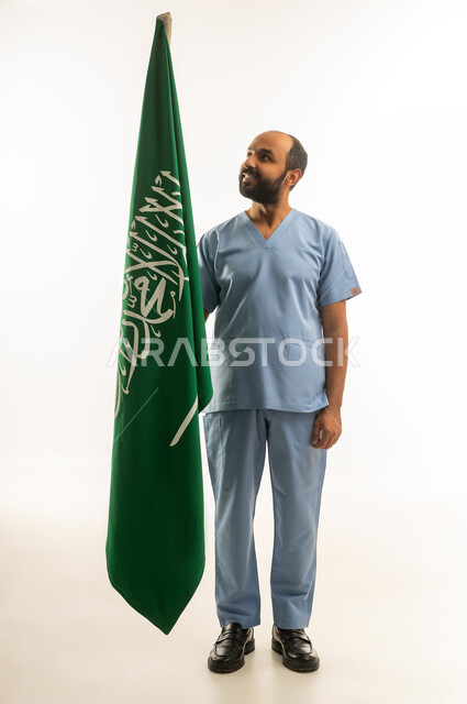 Saudi Male Doctor in Scrubs with National Flag