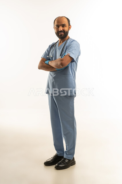 Saudi Male Doctor in Blue Scrubs Portrait