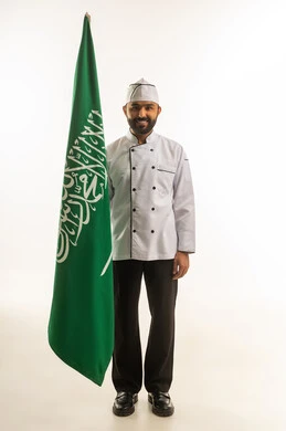 Saudi Male Chef Holding National Flag on White Background