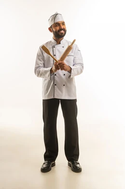 Professional Saudi Male Chef Holding Wooden Kitchen Utensils