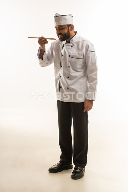 Arab Male Chef in White Uniform Tasting Food