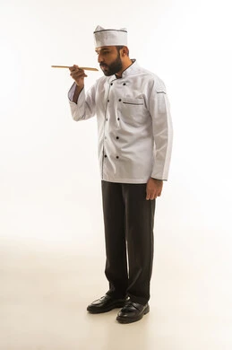 Saudi Professional Chef in White Uniform Tasting Food