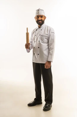 Indian Male Chef with Rolling Pin on White Background