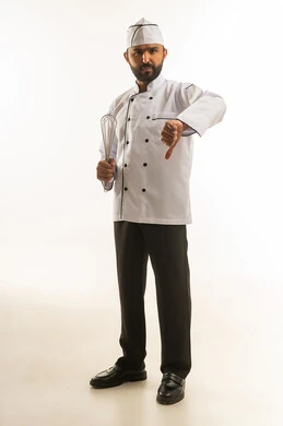 Arab Male Chef Gesturing Thumbs Down on White Background