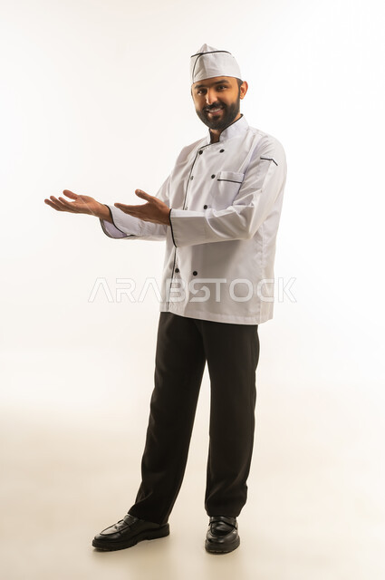Professional Saudi Chef in White Uniform Presenting