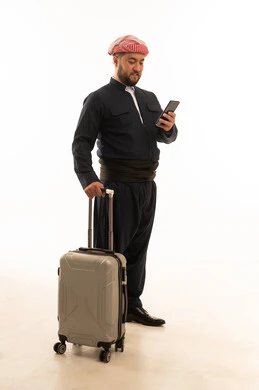 Kurdish Man with Suitcase Using Phone on White Background