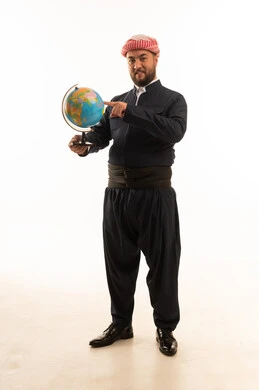 Kurdish Man in Traditional Attire Holding World Globe