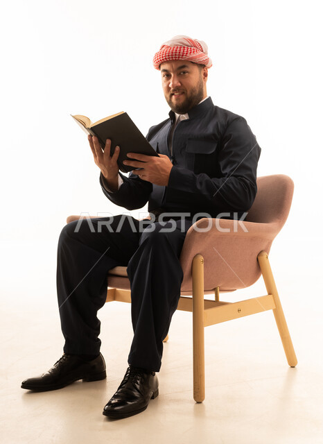 Kurdish Man in Traditional Dress Reading Book Studio
