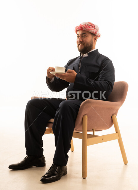 Kurdish Man in Traditional Black Attire Drinking Coffee