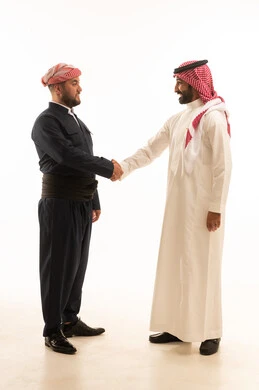 Saudi and Kurdish Men Handshaking on White Background