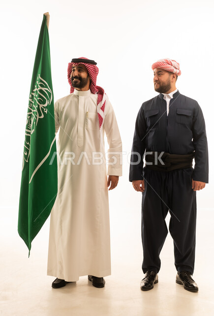 Saudi and Kurdish Men Holding Saudi Flag in Studio