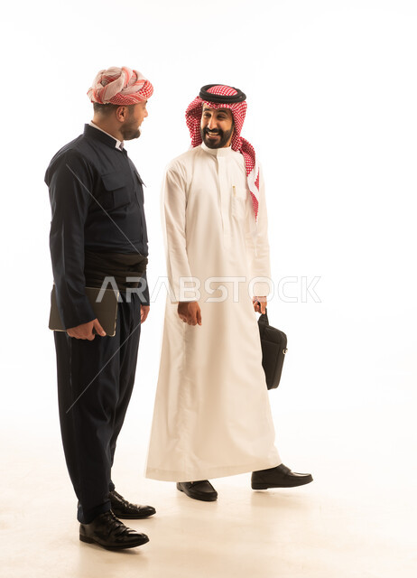 Saudi and Kurdish Men in Traditional Dress Talking