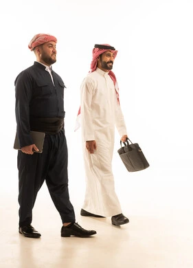 Saudi and Kurdish Businessmen Walking on White Background