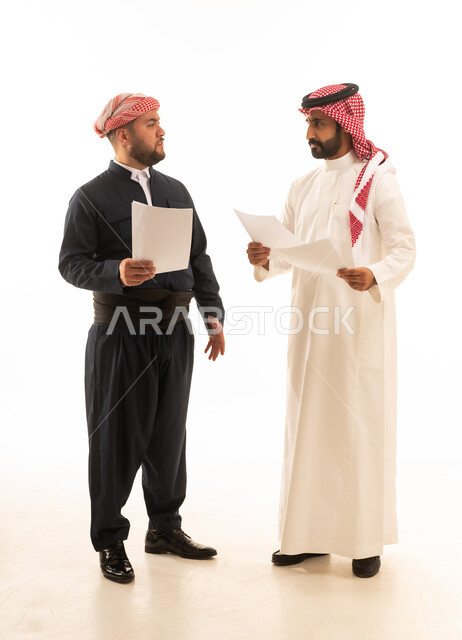 Saudi and Kurdish Men in Traditional Attire Holding Papers