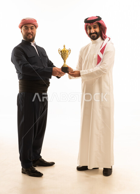 Saudi and Kurdish Men Holding Gold Trophy Success