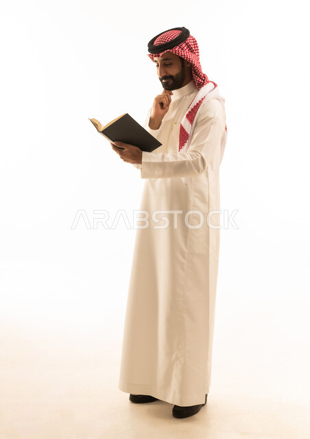 Saudi Man Reading Book on White Background