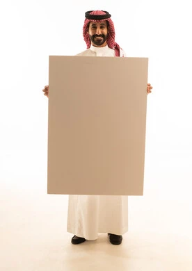 Saudi Man in Traditional Thobe Holding Blank Board