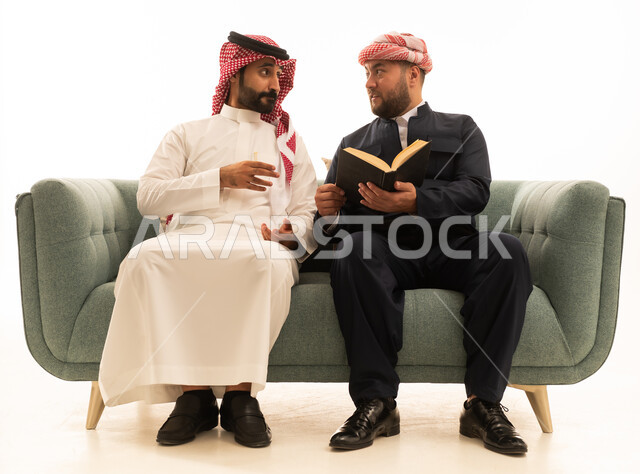 Saudi and Kurdish Men in Traditional Dress on Sofa