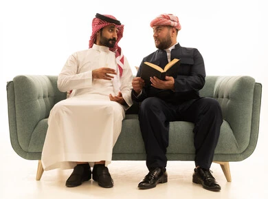 Saudi and Kurdish Men in Traditional Dress on Sofa