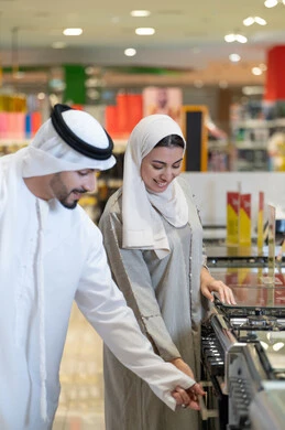 Emirati Couple Shopping for Kitchen Appliances in Showroom