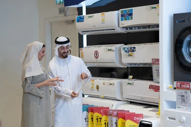 Emirati Couple Shopping for Air Conditioners in Store