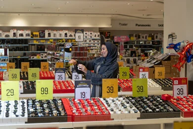 Saudi Woman Shopping for Watches in Electronics Store