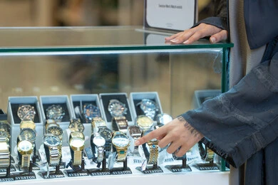 Saudi Woman Shopping for Luxury Watch in Retail Store