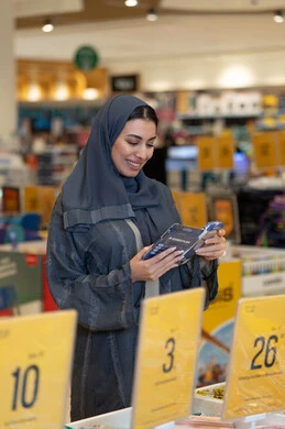 Arab Woman Shopping for Stationery in Retail Store