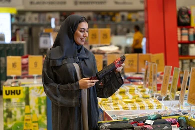 Saudi Woman in Black Abaya Shopping at Retail Store