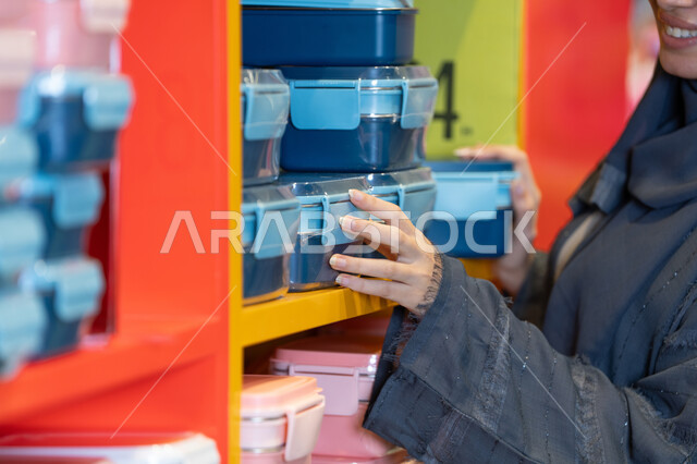 Saudi Woman Shopping for Food Containers in Retail Store