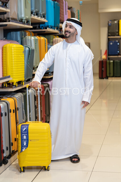 Emirati Man Shopping for Travel Luggage in Store