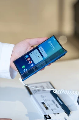 Saudi Man Holding Blue Samsung Galaxy Foldable Smartphone