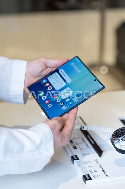 Saudi Man Holding Samsung Galaxy Fold Smartphone