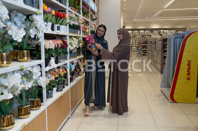 Arab Women Shopping for Artificial Flowers in Home Store