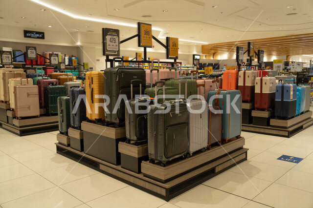 Colorful Travel Suitcases Display in Modern Retail Store