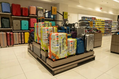 Suitcases and Travel Bags Display in Retail Store
