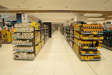 Retail Department Store Aisle With Organized Product Shelves