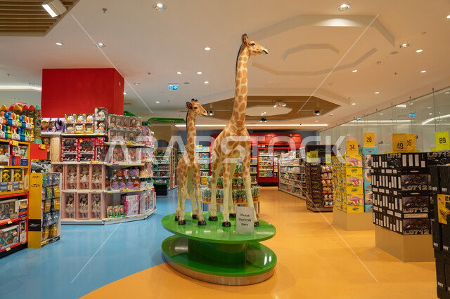 Indoor Toy Store Interior with Large Giraffe Statues
