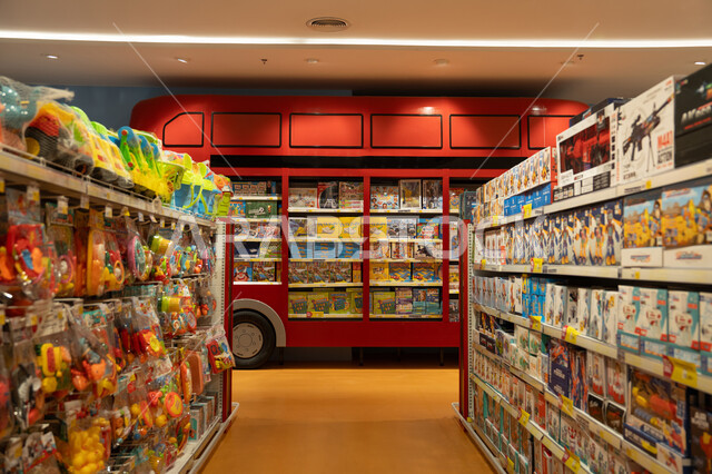 Interior of Toy Store Aisles with Red Bus Display Shelf