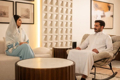 Saudi Couple Sitting in Modern Living Room Interior