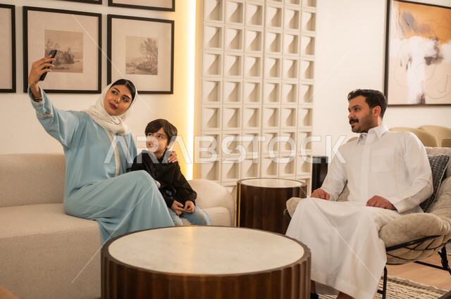 Saudi Family Taking Selfie in Modern Living Room