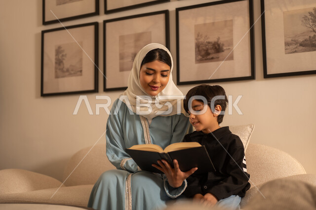 Saudi Mother and Son Reading Book at Home