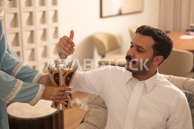 Saudi Man with Traditional Arabic Incense Burner