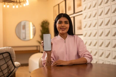 Saudi Woman Holding Smartphone with Blank Screen Mockup