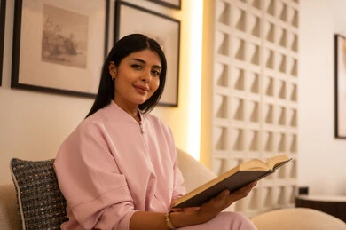 Arab Woman Reading Book in Modern Interior Home