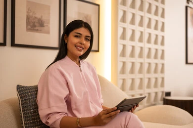 Arab Woman with Digital Tablet in Modern Home