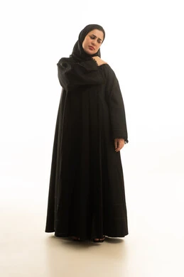 Saudi Woman in Abaya with Shoulder Pain White Background Saudi Woman in Abaya with Shoulder Pain White Background